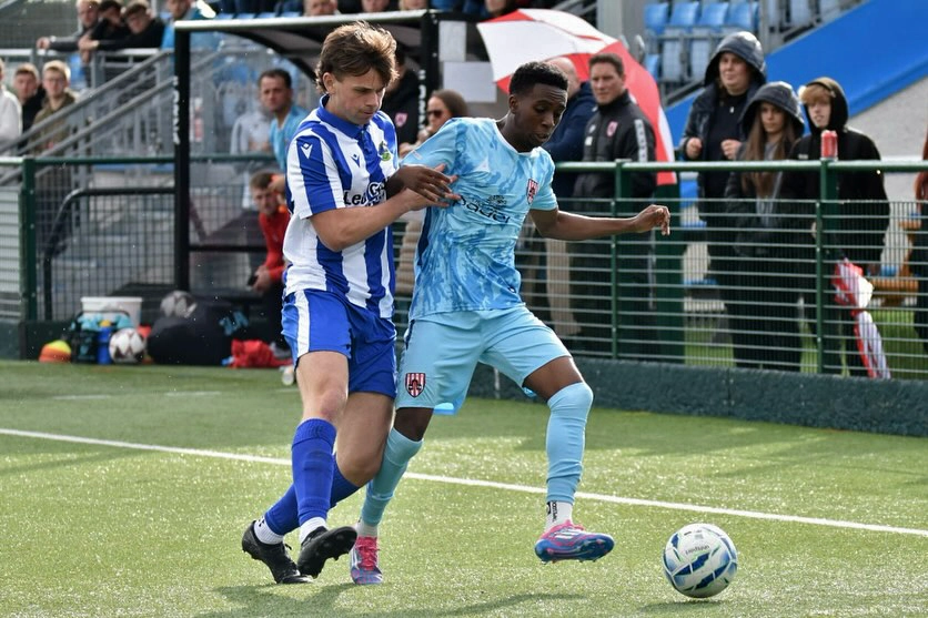 Muzzy Abdullahi tussels out wide with a Penrith defender.