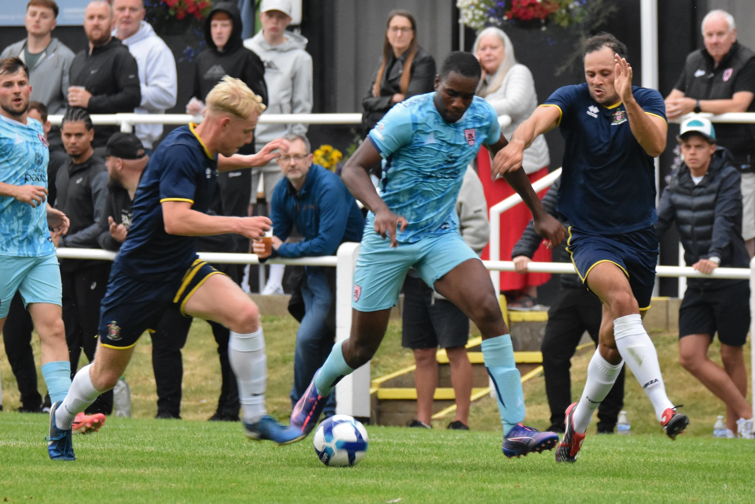260714_JBM_0228 Tolu Osiyemi dribbles past ex-Guisborough man Mason McNeill.